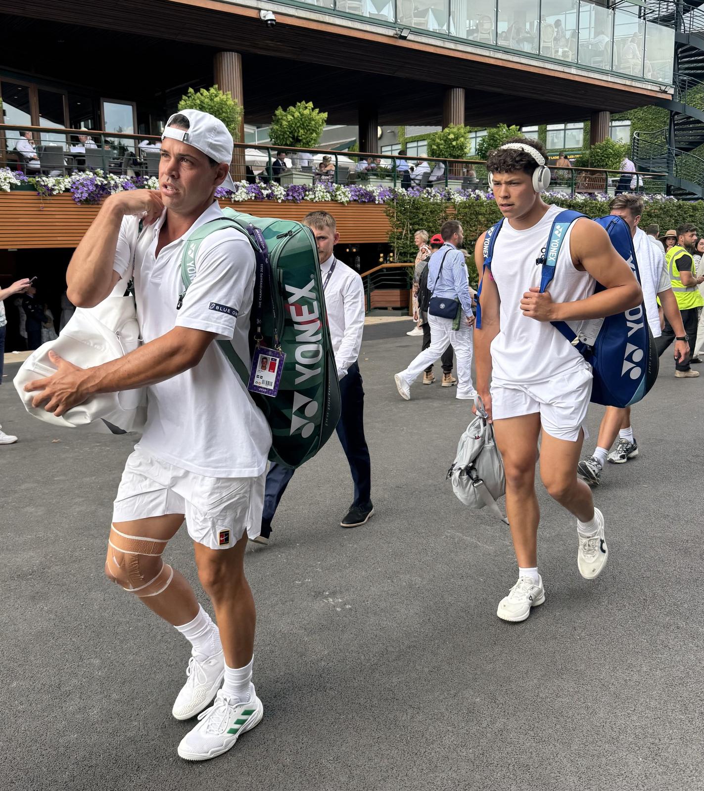 Players heading off the practice courts