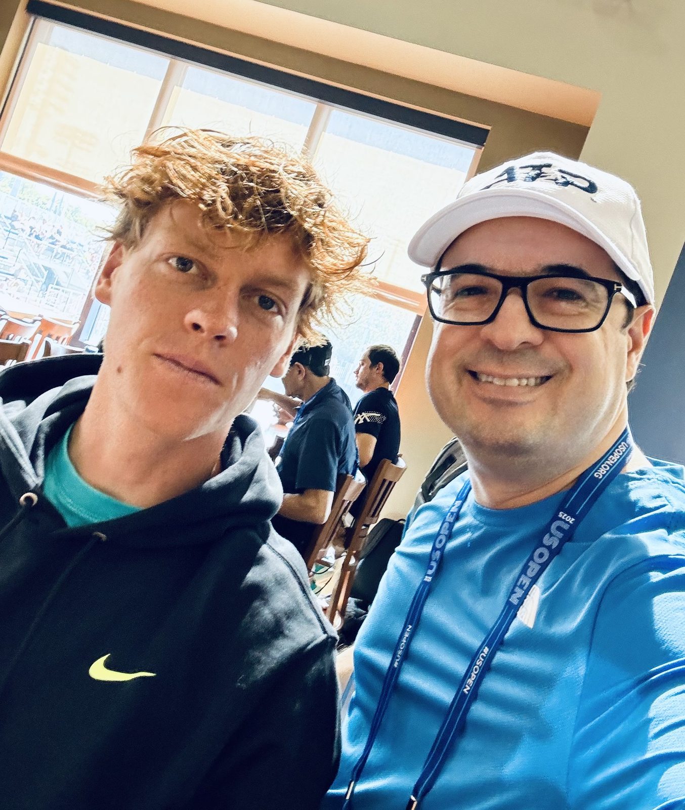 Christopher Beltran with Jannik Sinner at the US Open