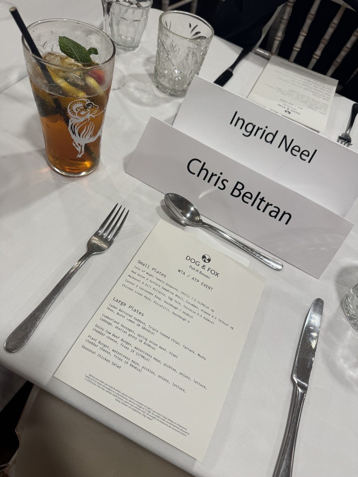 Dinner place card reading Ingrid Neel and Chris Beltran